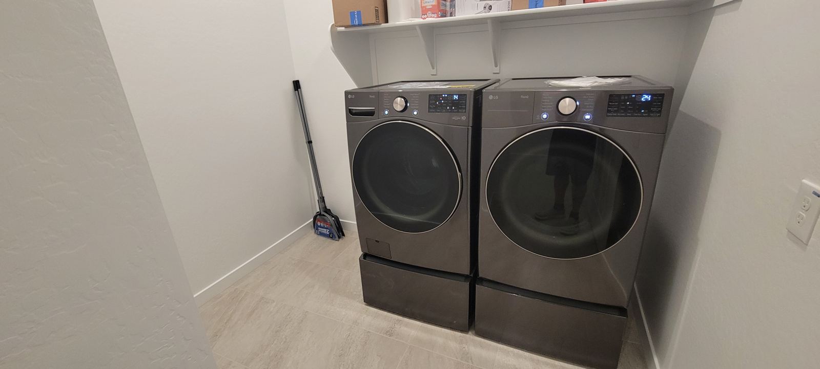 Washer and dryer set on pedestals